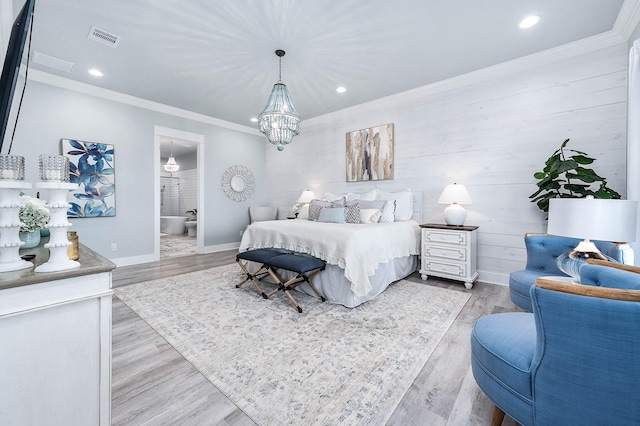 636 Villa Dr, Crystal Beach, TX 77650 - bedroom with light wood-style flooring, visible vents, baseboards, and ornamental molding