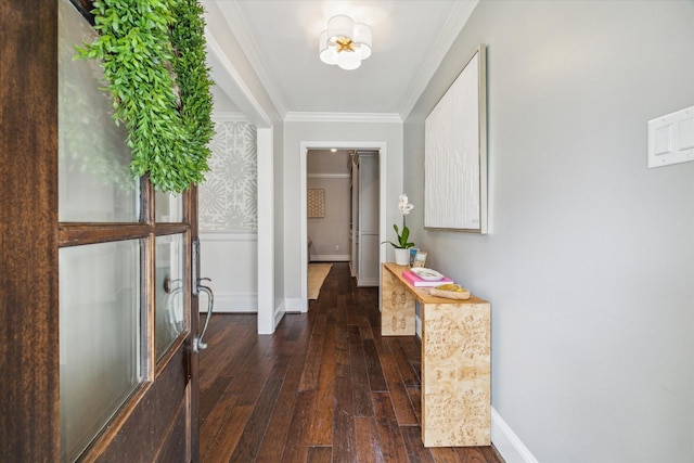 corridor featuring baseboards, ornamental molding, and dark wood-type flooring