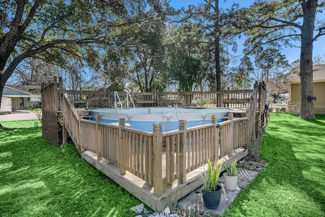 view of pool with a fenced in pool and a yard