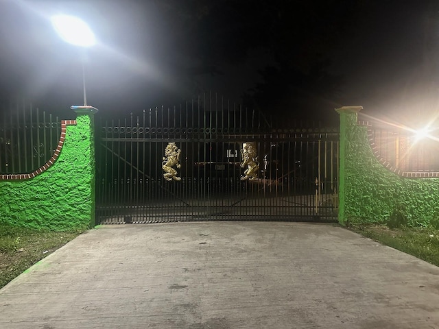 view of gate at twilight