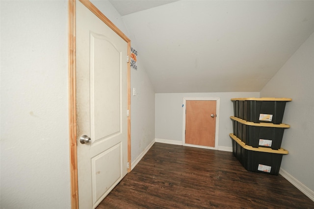 bonus room featuring vaulted ceiling, baseboards, and wood finished floors