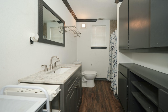 full bathroom with visible vents, toilet, ornamental molding, vanity, and wood finished floors