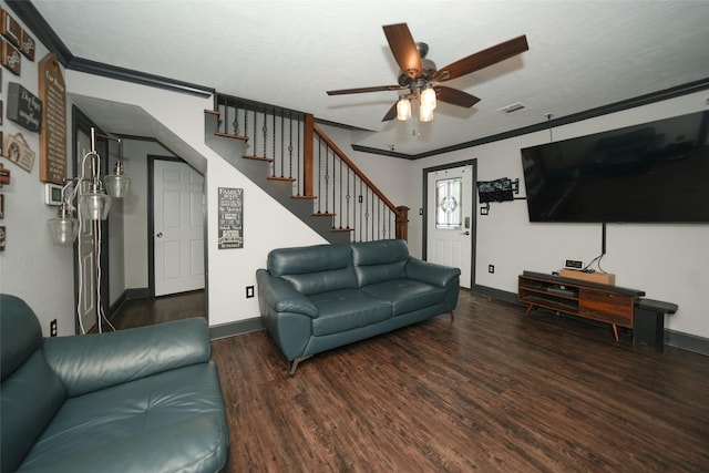 living room featuring wood finished floors, visible vents, baseboards, stairway, and crown molding