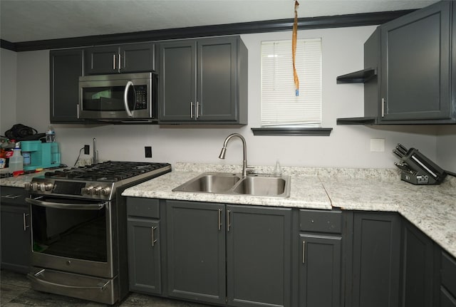 kitchen featuring gray cabinets, appliances with stainless steel finishes, open shelves, and a sink