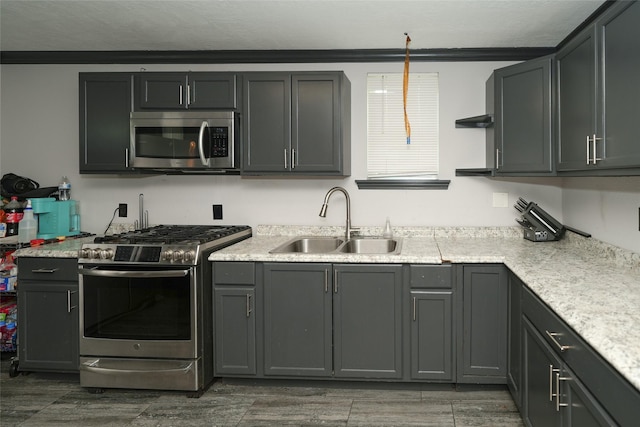 kitchen featuring open shelves, light countertops, appliances with stainless steel finishes, wood tiled floor, and a sink