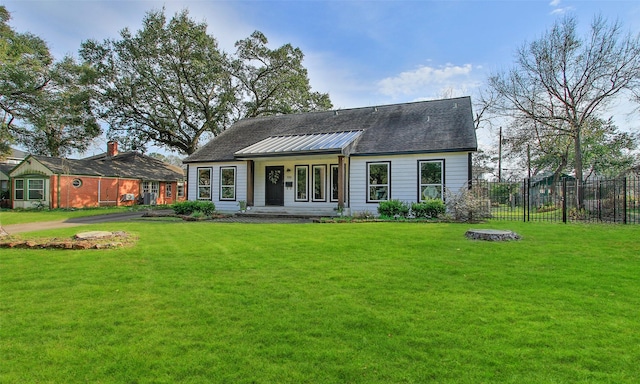 view of front of property with a front lawn, a porch, and fence