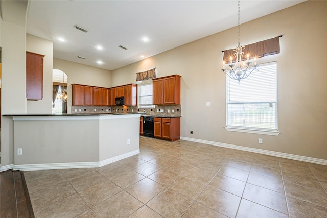 kitchen featuring tasteful backsplash, dark countertops, brown cabinetry, and black appliances