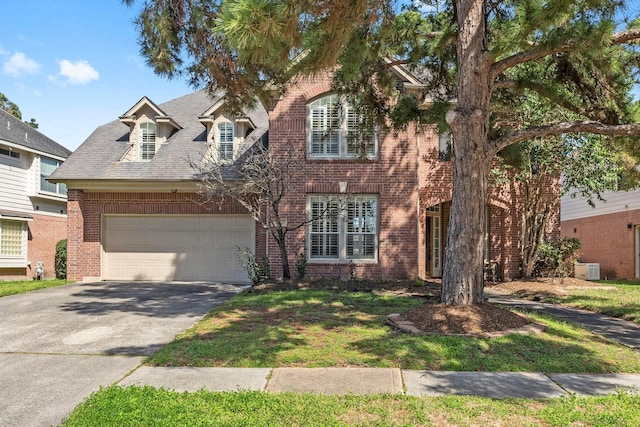 view of front of house featuring driveway, brick siding, and an attached garage