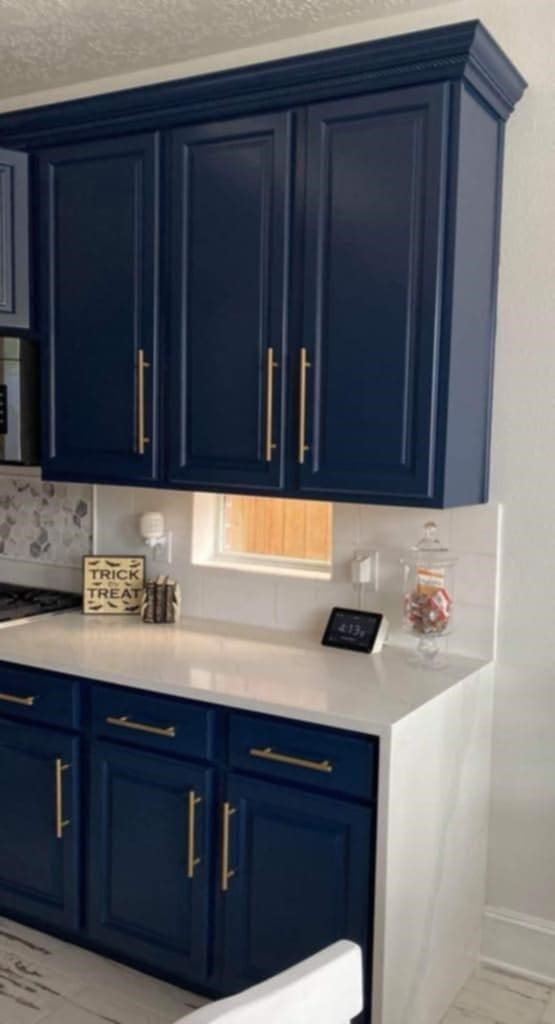 kitchen featuring light countertops and blue cabinetry