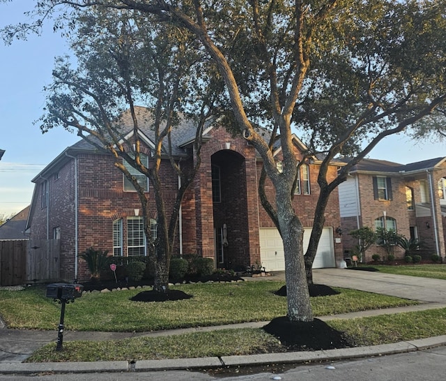 view of front of property with concrete driveway, brick siding, an attached garage, and a front lawn