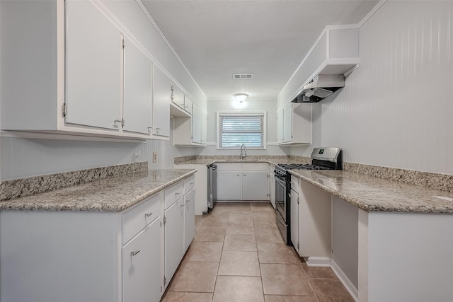 kitchen with visible vents, appliances with stainless steel finishes, white cabinetry, a sink, and light tile patterned flooring