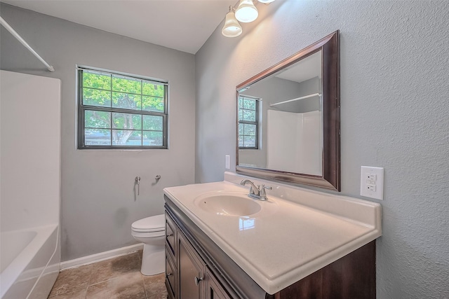 bathroom with shower / bath combination, toilet, vanity, tile patterned flooring, and baseboards