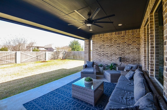 view of patio / terrace with ceiling fan, a fenced backyard, and an outdoor living space