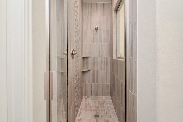 full bath with a shower stall