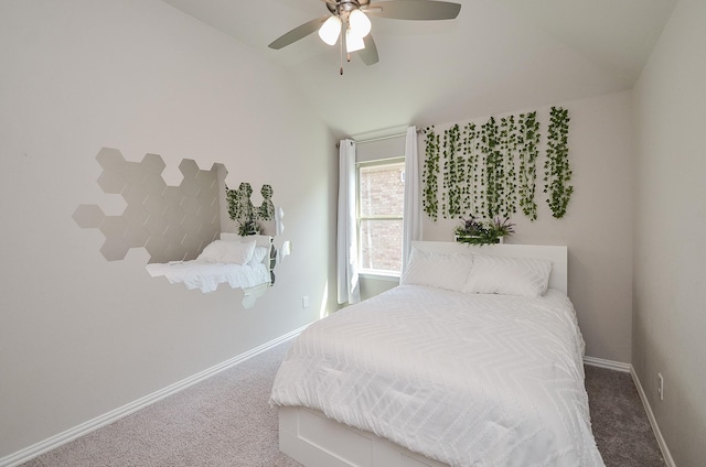 carpeted bedroom featuring a ceiling fan, lofted ceiling, and baseboards