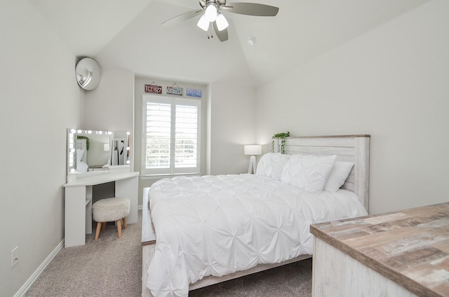 carpeted bedroom with ceiling fan, baseboards, and vaulted ceiling