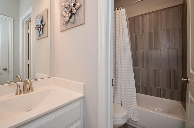 bathroom with toilet, shower / bath combo, and vanity