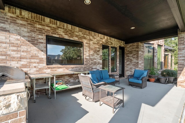 view of patio / terrace featuring an outdoor kitchen and outdoor lounge area