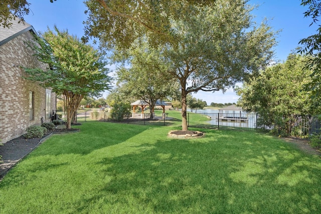 view of yard with a gazebo and fence