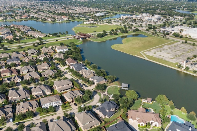 drone / aerial view with a residential view and a water view