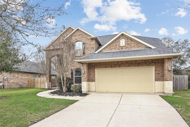 view of front of house featuring a front yard, roof with shingles, and fence