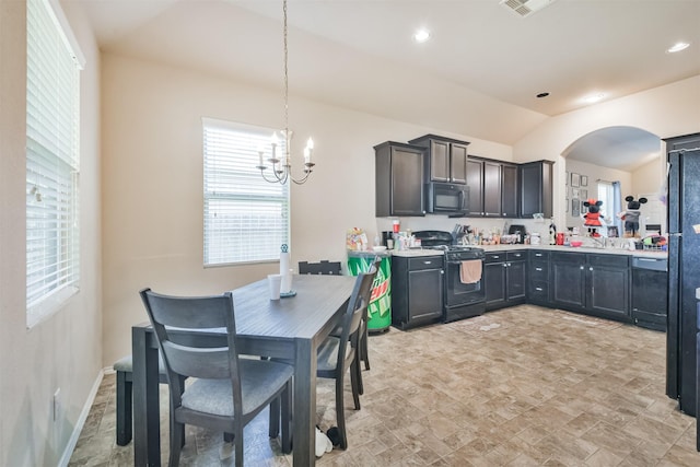 11430 Barbican Ct, Conroe, TX 77304 - kitchen featuring arched walkways, an inviting chandelier, light countertops, black appliances, and a sink