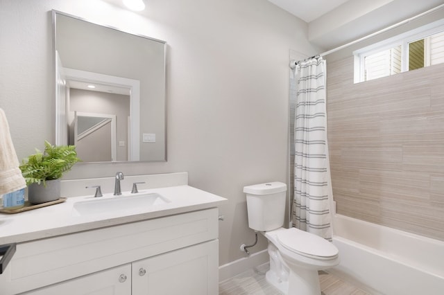 bathroom featuring shower / bath combination with curtain, baseboards, vanity, and toilet