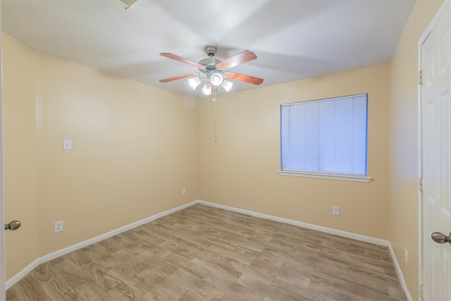 unfurnished room featuring light wood-type flooring, ceiling fan, and baseboards