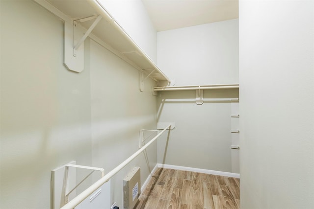 walk in closet featuring light wood-style flooring