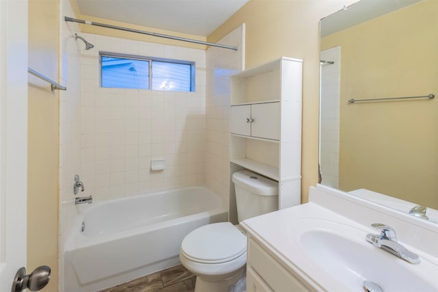 full bathroom featuring toilet, tub / shower combination, and vanity