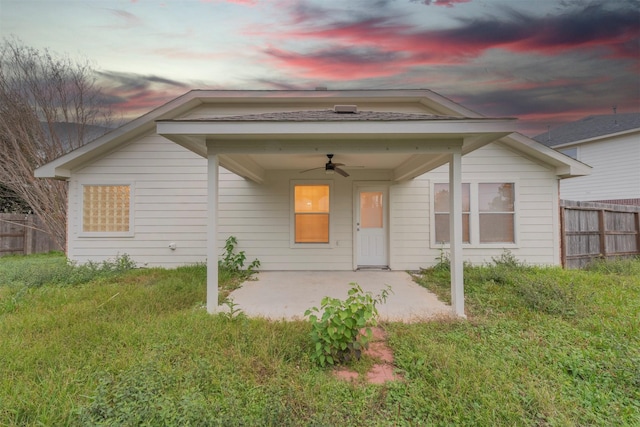 exterior space with fence, a ceiling fan, and a patio