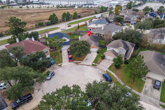 birds eye view of property with a residential view