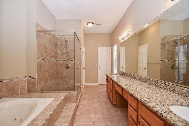 bathroom featuring a sink, visible vents, a shower stall, a whirlpool tub, and double vanity