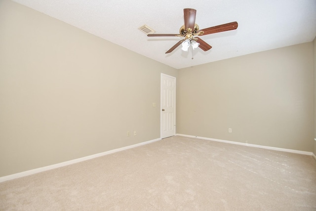 unfurnished room with baseboards, visible vents, a ceiling fan, and light colored carpet