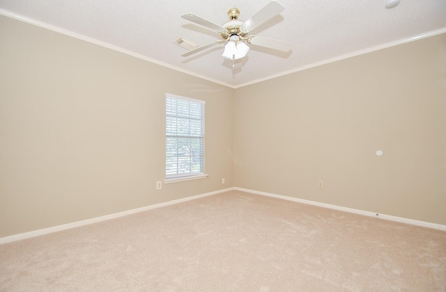 unfurnished room featuring crown molding, visible vents, a ceiling fan, light carpet, and baseboards