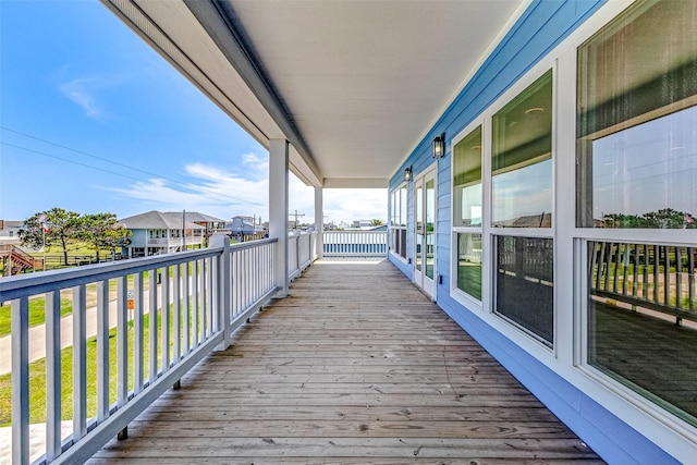 wooden deck featuring a residential view