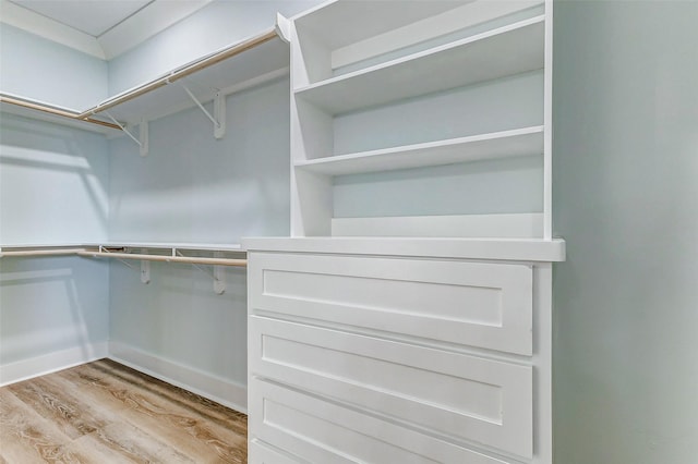 spacious closet with light wood-style floors