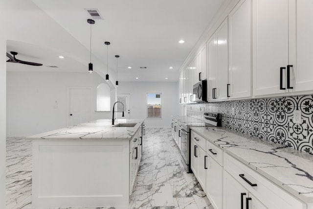 kitchen with visible vents, marble finish floor, a sink, recessed lighting, and stainless steel appliances