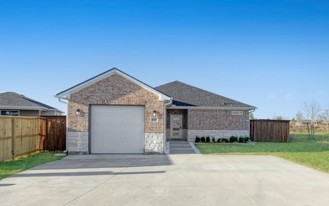 single story home featuring fence, driveway, a front lawn, a garage, and brick siding