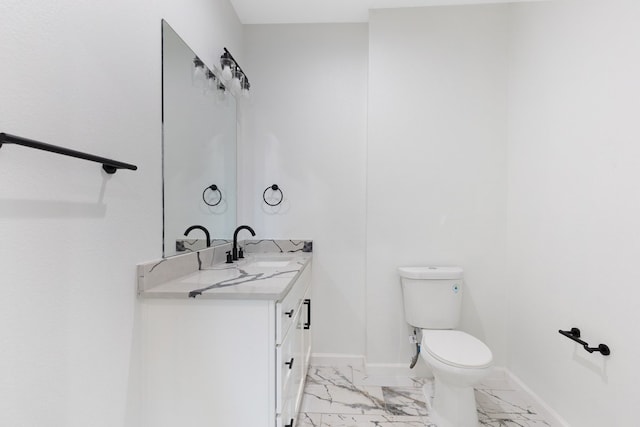 half bathroom featuring marble finish floor, toilet, vanity, and baseboards