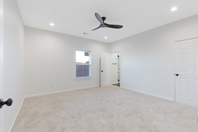 spare room featuring recessed lighting, visible vents, carpet floors, and ceiling fan