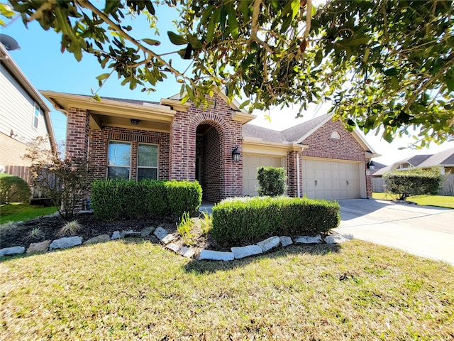 ranch-style home featuring a front lawn, concrete driveway, brick siding, and an attached garage