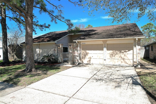 ranch-style house featuring brick siding, driveway, and an attached garage