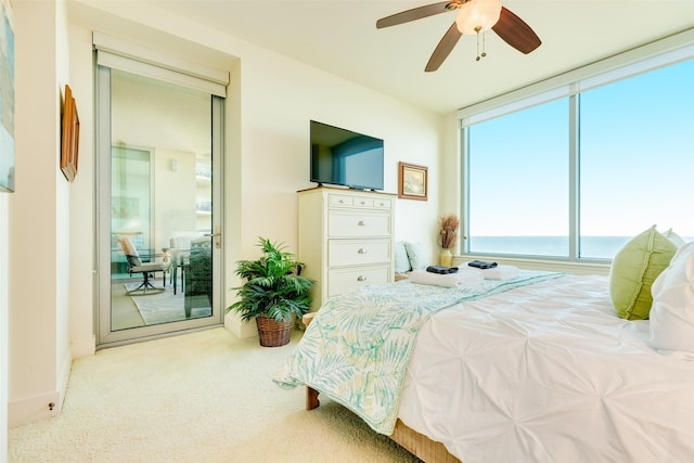 carpeted bedroom featuring a ceiling fan