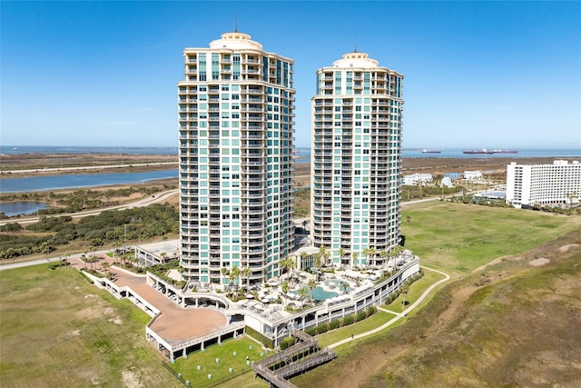 birds eye view of property featuring a water view and a city view