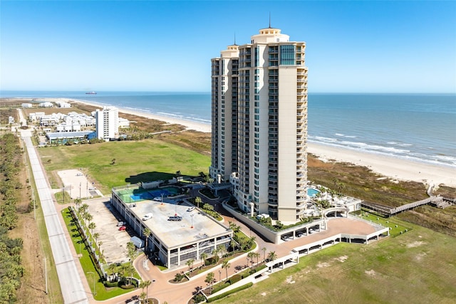 drone / aerial view with a water view and a view of the beach