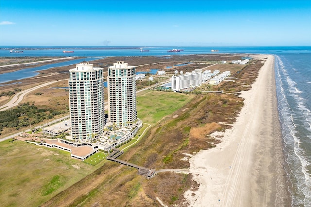 drone / aerial view with a view of the beach, a water view, and a city view