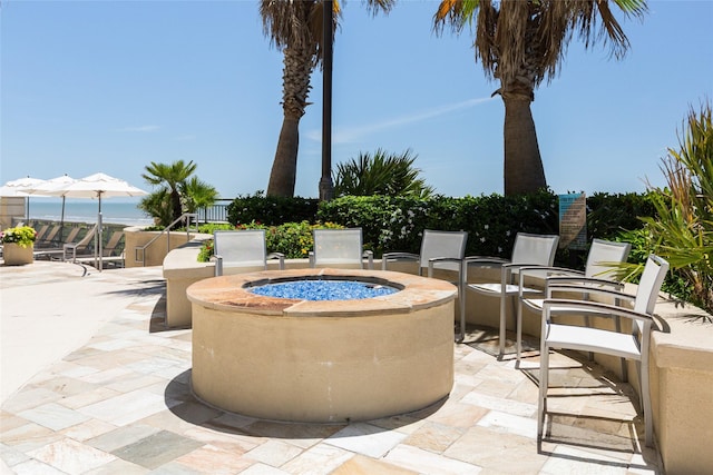 view of patio / terrace featuring a fire pit