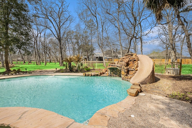 view of swimming pool with a fenced in pool, a yard, and fence