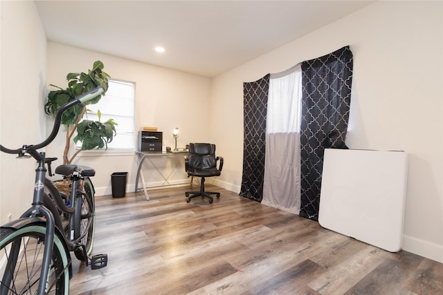 office area with recessed lighting, wood finished floors, and baseboards